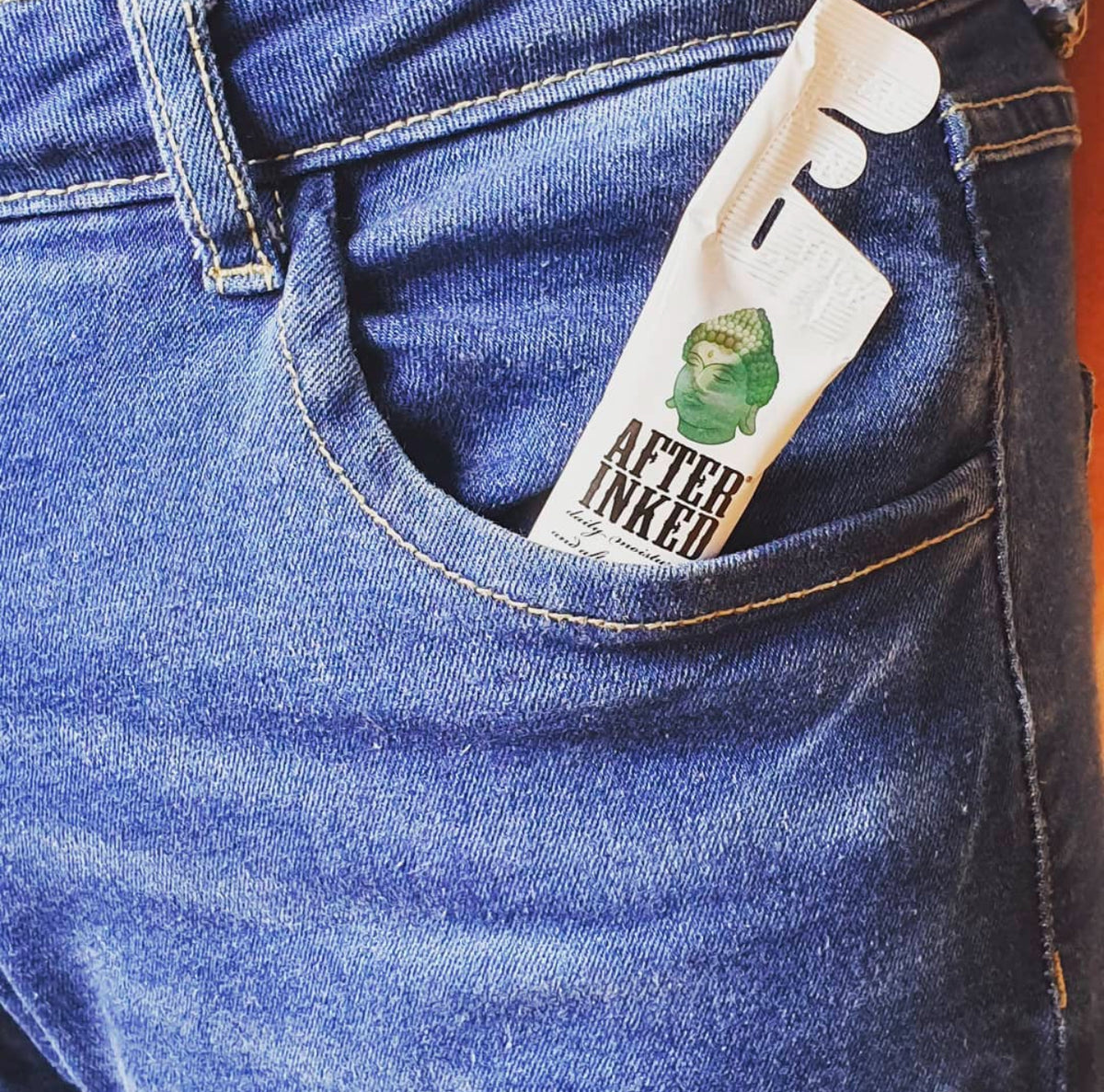 After Inked tattoo moisturizer in jean&